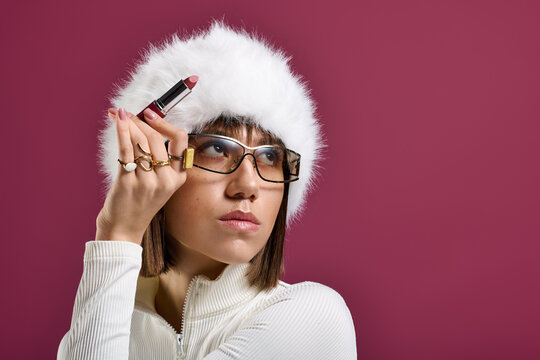 Stylish woman with a playful attitude preparing for a chic winter evening