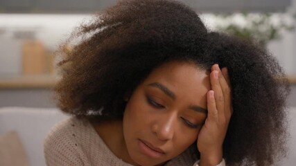 Upset African American girl female woman chatting scrolling mobile phone receive bad news holding head frustration sadness online problem smartphone failure crash mistake error application at home - Powered by Adobe