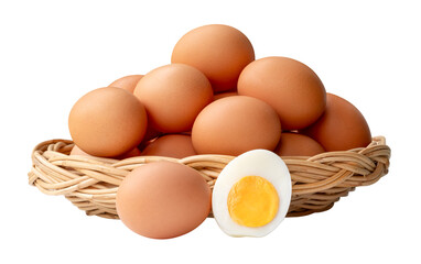 Many raw brown chicken eggs with boiled eggs and egg yolk in a half in stack in wicker basket isolated with clipping path in png file format