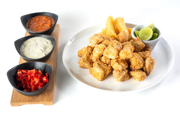 Peruvian food: chicharron de pescado or fish cracklings. White background