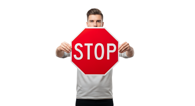 Man holding red stop sign in front of his face isolated on transparent background person showing warning symbol in studio, concept of prohibition