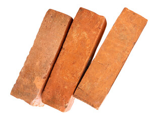 Side view of three cracked old red or orange bricks in stack isolated on white background with...