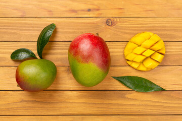 Fresh ripe mango on wooden background, top view