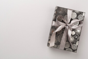 Stylish grey gift box on color background, top view