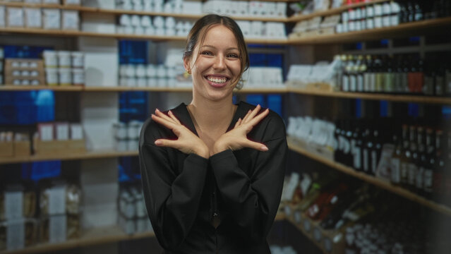 Woman smiling broadly and pressing hands to her cheeks in a pharmacy aisle with shelves of bottles and boxes; warm gratitude.