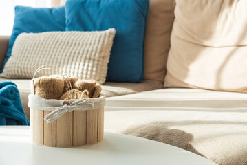 Knitting Setup with Yarn Basket and Cozy Couch in Sunlight