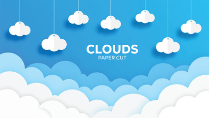 Paper cut clouds hang against a bright blue sky background