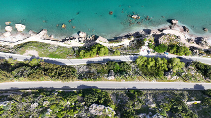 Aerial drone photo of beautiful beach with wonderful seaside promenade of Kato Petres featuring Cave Archangel Michael Panormitis, Rhodes island, Dodecanese, Greece