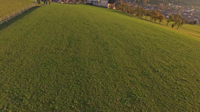 Drone view of Chiesa di San Valentino and mountains in Seis, Italy.