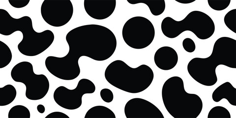 Seamless abstract monochrome pattern of organic black shapes and circles on a clean white background, resembling cow spots or dalmatian print, ideal for design.