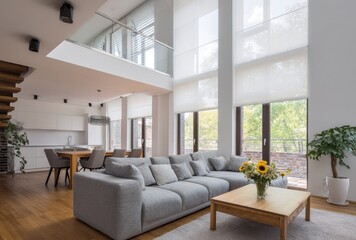 Fototapeta premium Modern living room interior design with sofa table flowers and large windows