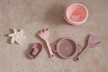 Toy Plastic sandbox accessories on carpet
