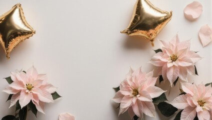 Festive flat lay with pink flowers and golden star balloons.
