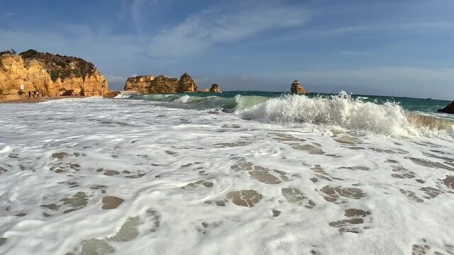 Handheld Footage from the Water at Praia Dona Ana Beach Lagos Algarve Southern Portugal Coast Swimming Ocean Sea on a Sunny Day Big Surf Waves 4K POV Footage