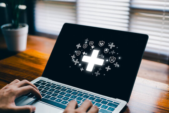 A person using a laptop with digital health and insurance icons representing medical protection, online healthcare services, safety coverage, and modern insurance technology for family well-being.