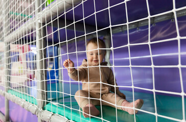 Little baby having fun at children's entertainment center