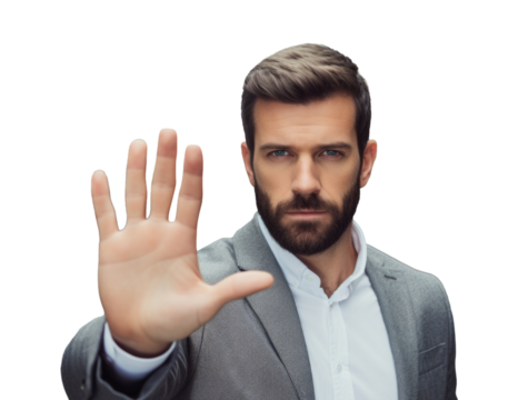 A close-up of a man in a suit giving a stop sign with his hand. His palm is extended forward in a negative position.