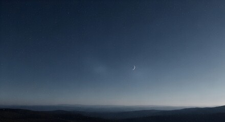 Crystalline moon hangs above dark hills