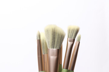 Fototapeta premium Premium makeup brushes set on white background. Beauty concept.