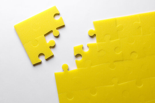 Yellow puzzle pieces. Teamwork, business concept