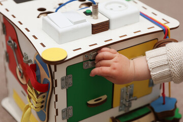 Wooden cube for developing motor skills of small children