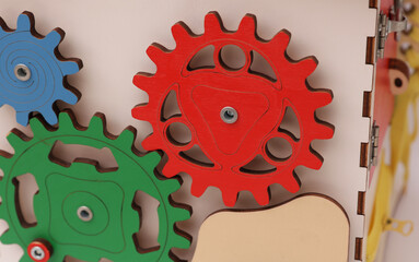 Wooden cube for developing motor skills of small children