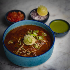Delicious Spicy Nihari with Ginger and chili lemon Garnish