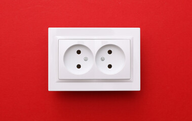 Electrical sockets on a red background