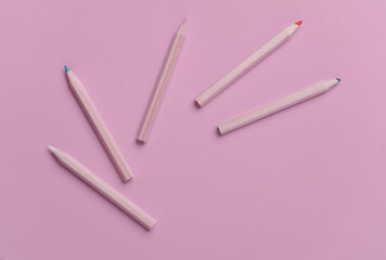 Set of wooden colored pencils on pink background. Creativity, art