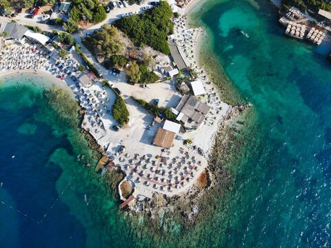 Ksamil, mass tourism vacation resort town in Southern Albania. Beach drone view.