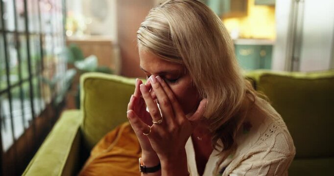 Headache, massage and woman with stress in home, exhausted and overwhelmed with brain fog. Migraine, frustrated and tired person with pain from temple pressure, fatigue and burnout in overthinking