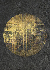 Large abstract circular gold paint texture on a dark concrete wall