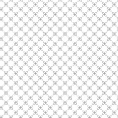 Repeating pattern of small floral shapes on a white background creating a geometric design texture