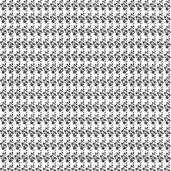 Repeating pattern of small black floral sprigs with leaves on a white background creating a dense texture