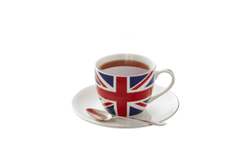 Tea served in a Union Jack mug resting on a light wood backdrop

