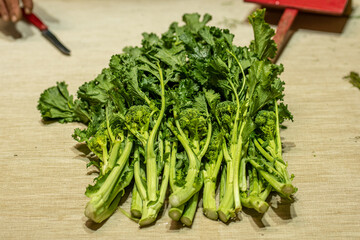 Cime di rapa, turnip greens, rapini or broccoli rabe in a street food market, green cruciferous vegetable, veggies, mediterranean cuisine, Puglia, Italy