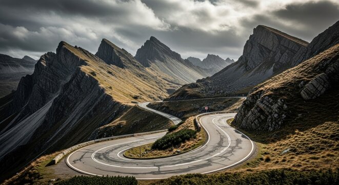 A winding road through a mountainous landscape with dramatic clouds in the sky. - Powered by Adobe