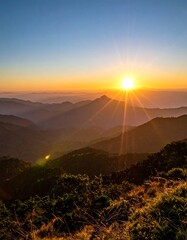 Golden Sunrise Over Mountain Peaks - A Breathtaking Landscape.