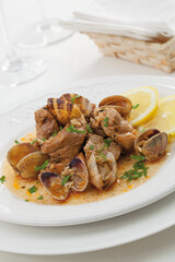 Pork loin stew with clams and green sauce