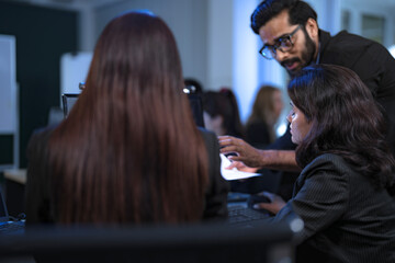 In a 24 7 Security Operations Center, a diverse incident response team works together under pressure, analyzing real-time threat intelligence data to defend against a live cyberattack.