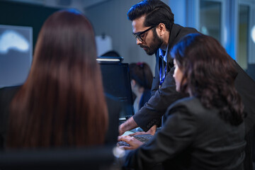 In a 24 7 Security Operations Center, a diverse incident response team works together under pressure, analyzing real-time threat intelligence data to defend against a live cyberattack.