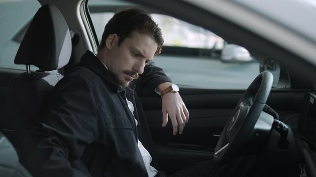 Car buyers exploring vehicles with sales agent assistance at dealership