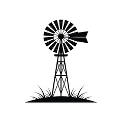 Classic farm windmill silhouette with grass