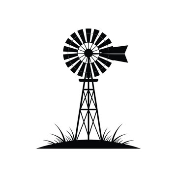 Classic farm windmill silhouette with grass