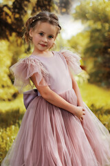 Whimsical Portrait of a Young Girl in a Pink Tulle Gown