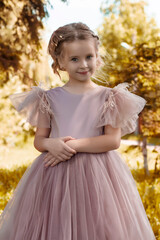 Whimsical Portrait of a Young Girl in a Pink Tulle Gown