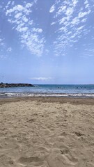 Sunny Day on the Atlantic Coastline, Sandy Beach With Blue Sky and People Swimming in Maspalomas, Gran Canaria, Spain.