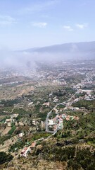 View from Mirador El Lance above Los Realejos, showing cultivated valleys, houses, and distant Atlantic coast in northern Tenerife, Canary Islands, Spain.