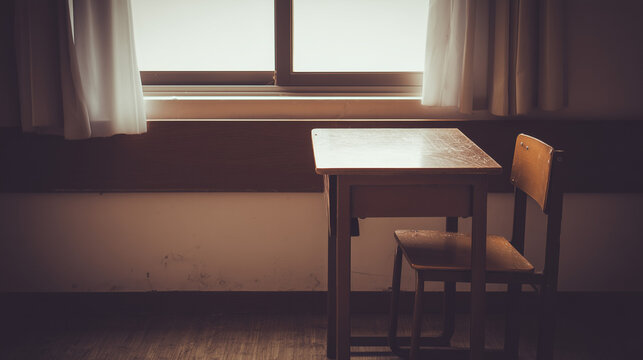 melancholy. Single desk in corner of empty classroom with soft natural light. wellbeing guides, coaching materials, designed for mental health education and mindfulness programs.