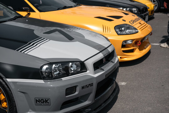 JDM car meet - Japanese cars owners gathering - yellow Toyota Supra, grey Nissan Skyline GT-R and yellow Mazda RX-7. Kyiv, Ukraine - May 10 2025